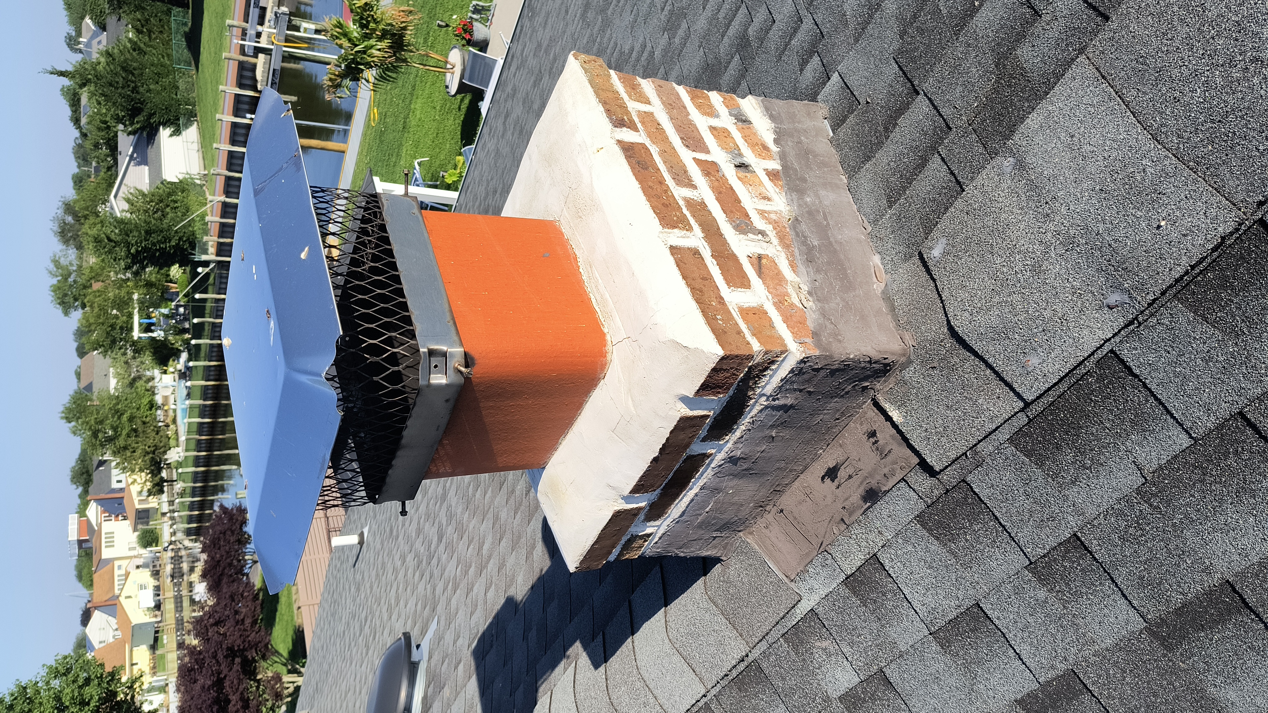Full chimney masonry rebuild and restoration in Baldwin, NY