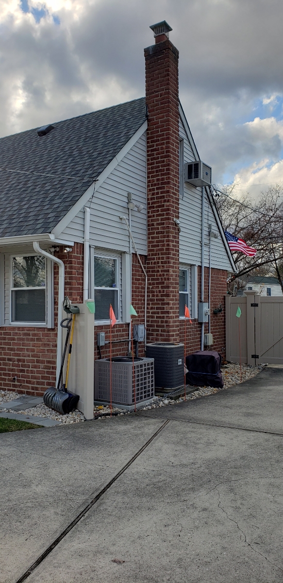 Professional chimney repointing restoring brick joints in Baldwin, NY