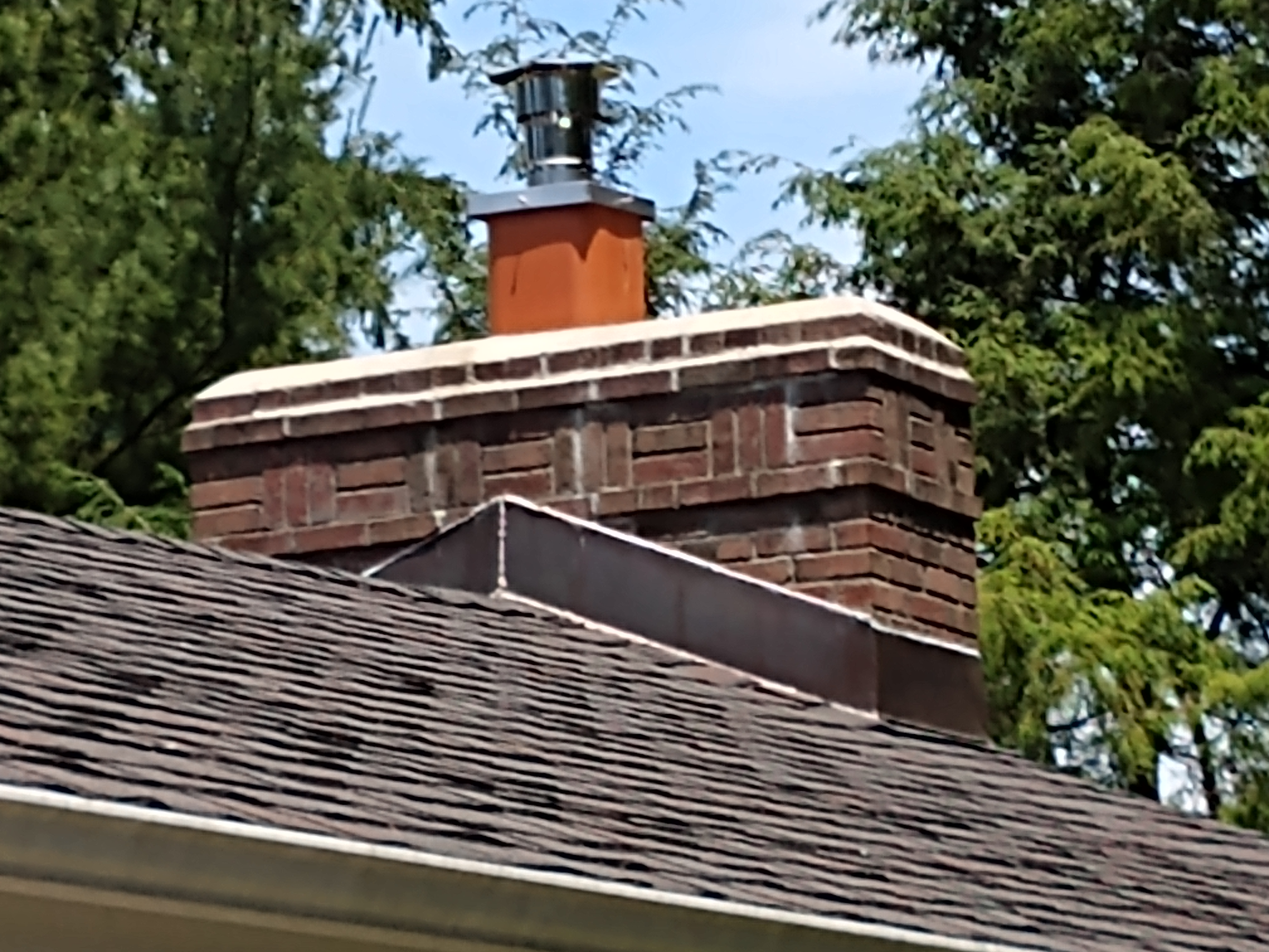 Stainless steel chimney cap with animal guard in Baldwin, New York